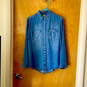 Button front denim shirt.